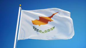Cyprus flag waving against clean blue sky, close up, isolated with clipping path mask alpha channel transparency